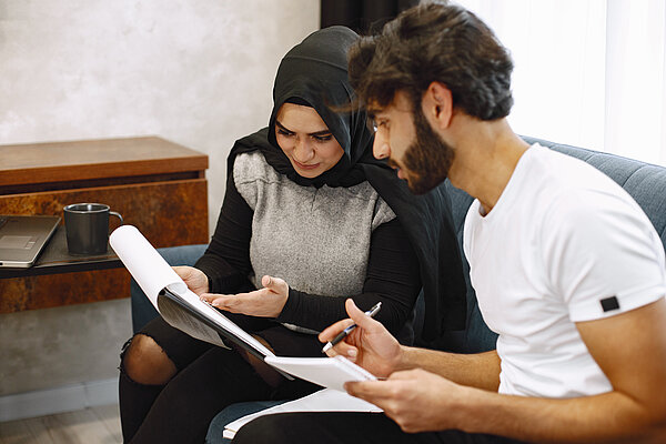 Two students registering for university programme.