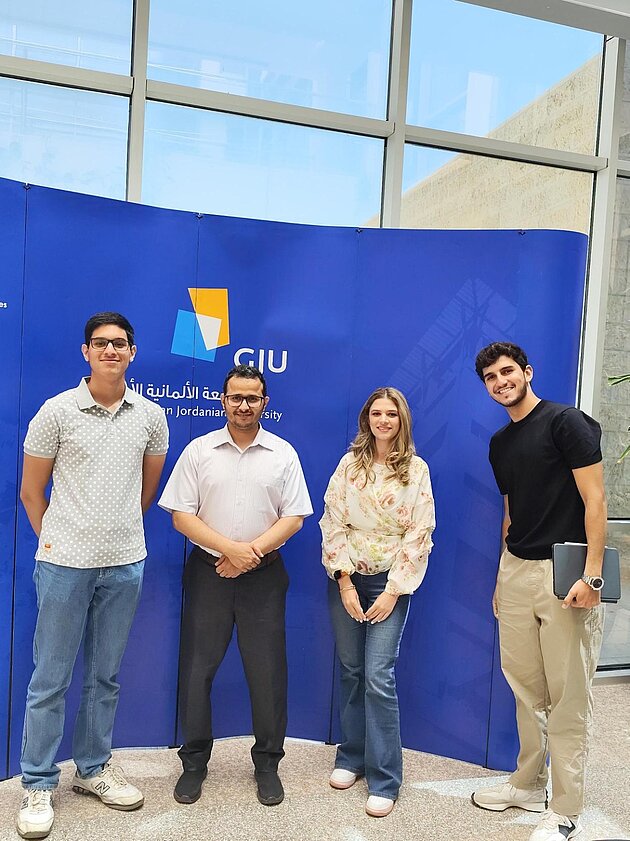 Ahmad Alkhawaja, Ala' Alturki and Mahmoud Alsaify, the first Hosted Programmes students in achieving a C1 German proficiency, with their German lecturer Abdalsalam AlHuda.